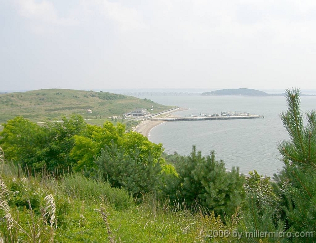 060727SpectacleIsland8 and a great view down to Spectacle Island's swimming beach, pier and headquarters building.