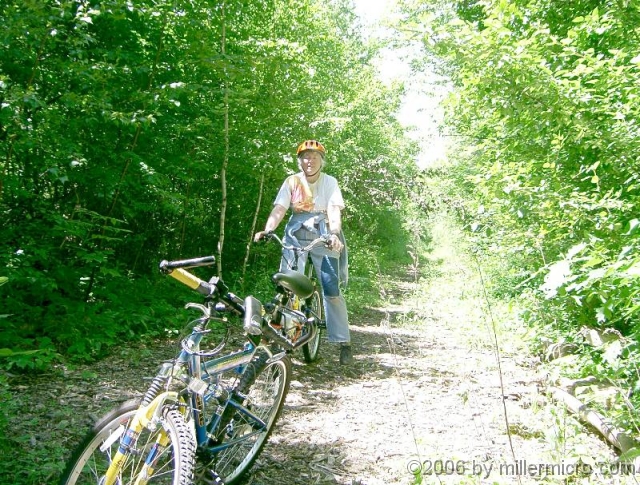 040605CRT3 North of Route 30, the rails and ties were removed in 1991. Volunteers have cleared trees and brush, so the trail looks like this.
