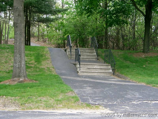 050514StairsAndRamp Also in Saxonville, at 500 Old Connecticut Path near the CRT, this combination of steps and a ramp shows the way to welcome bicycles and wheelchairs back to office buildings. Alternate transportation depends upon willing users, but also upon support from towns and businesses.