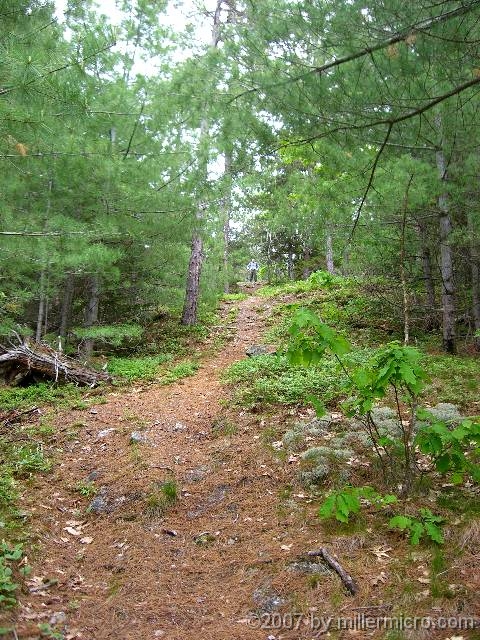 070602ColdRiverCamp_BobYellsDown Bob Goeke yells down from higher up on the Conant Trail loop.