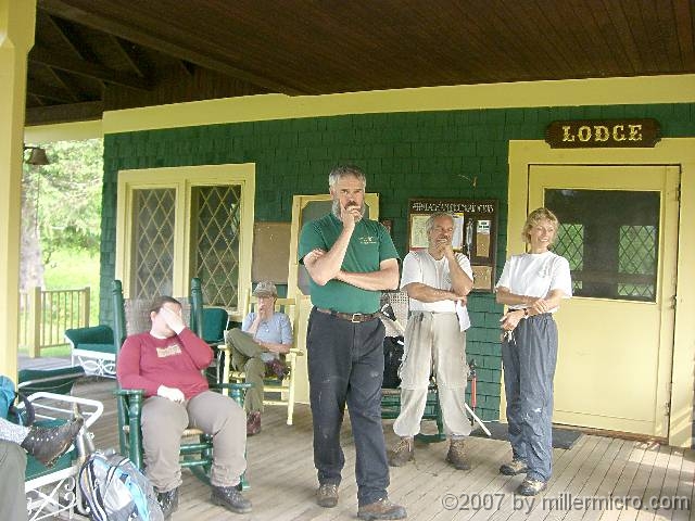 070602ColdRiverCamp_LodgePorch1 Its porch has the usual assortment of rockers and gliders and occupants..