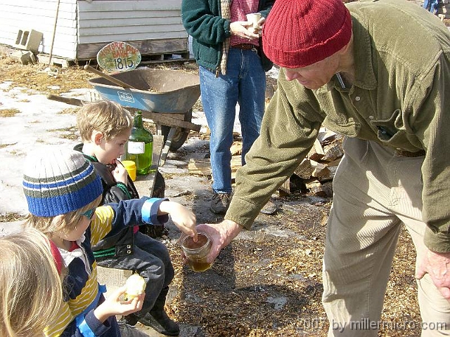 070303SyrupingColonialStyle3 And then, everyone enjoyed a taste sample of the partly-evaporated syrup, made Colonial-style.